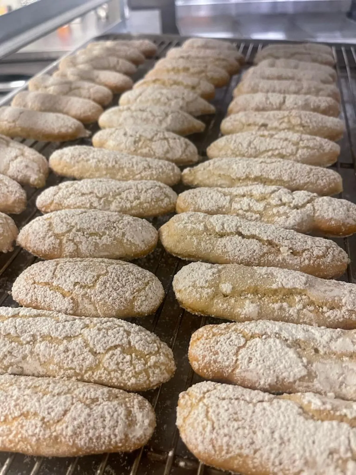 Rows of freshly baked goods cooling on a rack